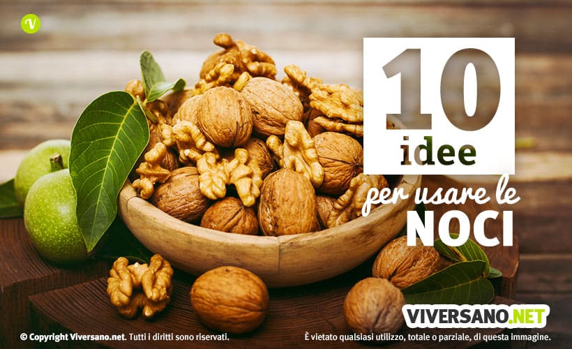 Noci con guscio e sgusciate in una ciotola di legno