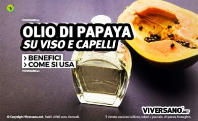 Olio di papaya e frutto fresco sopra un tavolo
